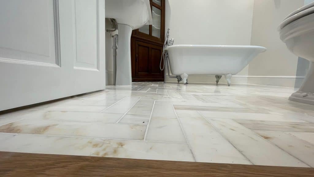 Marble herringbone floor in a bathroom exeter.