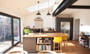 Kitchen island in an extension in exeter. Exposed steel beams above